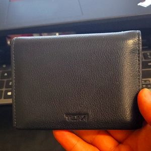 Lightly used Tumi bi fold wallet